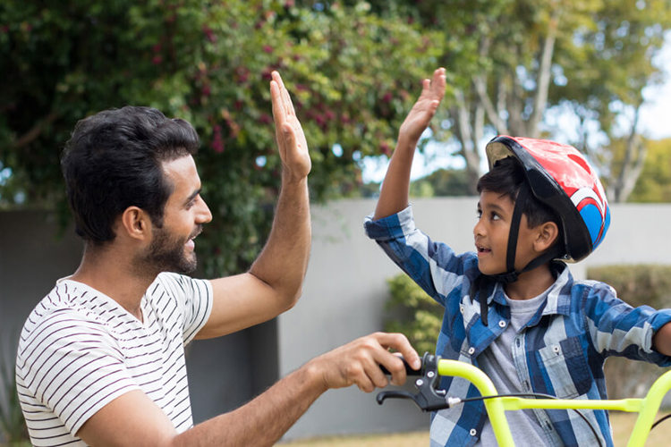 Dad with son on a bike